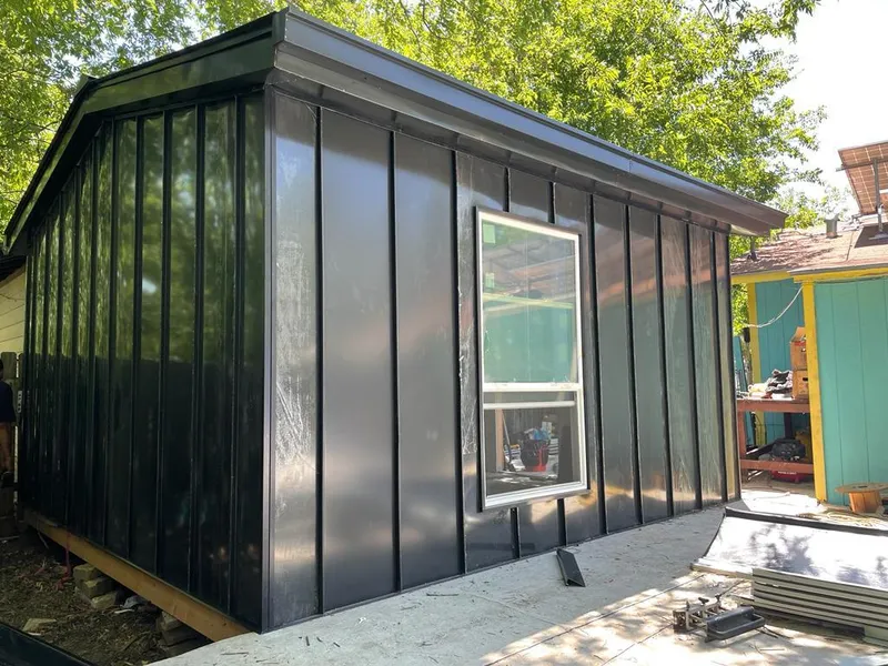 Black standing seam metal wall panels for Roof Inspection in Cedar Hills